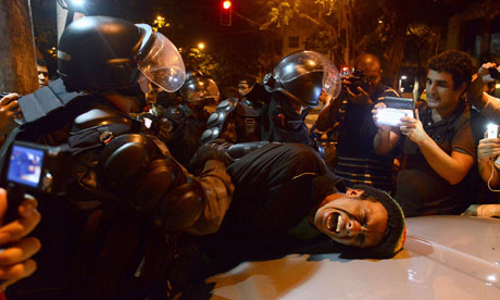Demonstrator detained by riot police, Rio de Janeiro, 18/7/13
